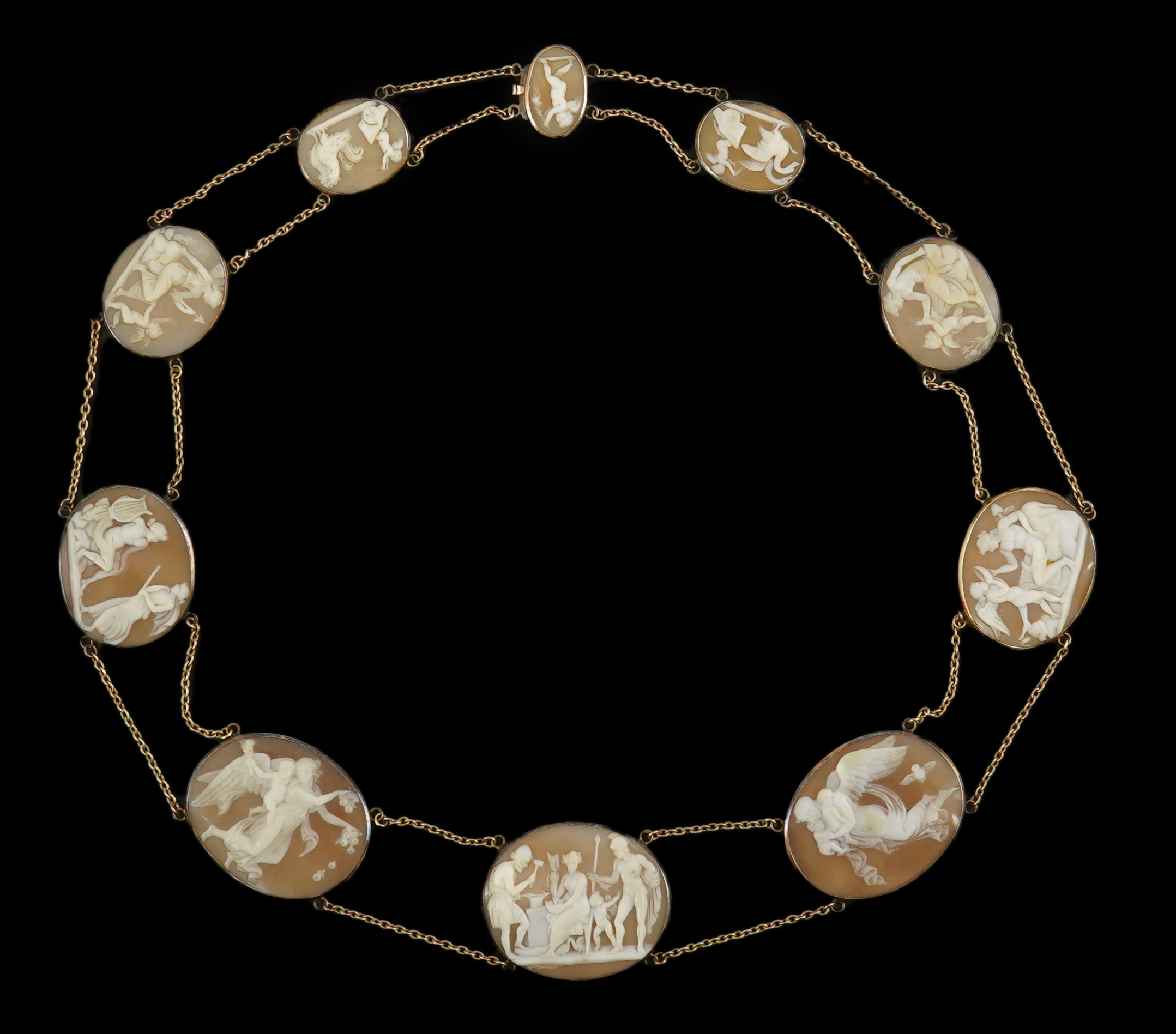 An early 19th century Italian Grand Tour gold double chain link and ten graduated oval cameo shell set necklace